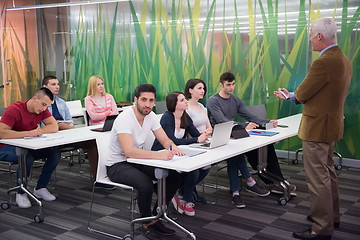 Image showing teacher with a group of students in classroom