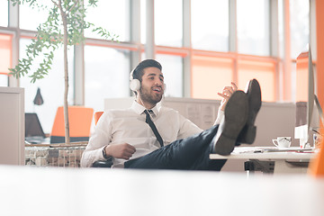 Image showing relaxed young business man at office