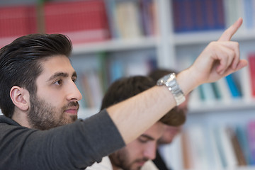 Image showing group of students  raise hands up