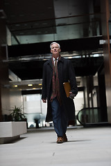 Image showing handsome senior business man walking