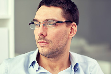 Image showing portrait of businessman in eyeglasses at office