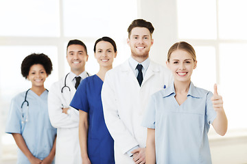 Image showing happy doctors showing thumbs up at hospital