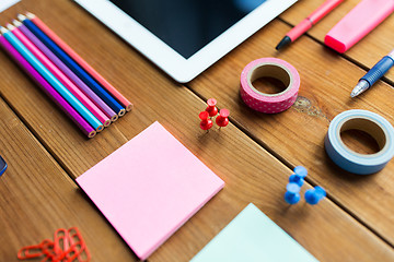 Image showing close up of school supplies and tablet pc