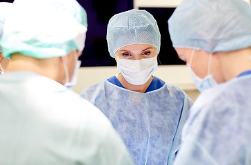 Image showing group of surgeons in operating room at hospital