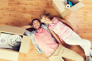 Image showing couple with big cardboard boxes moving to new home