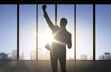 Image showing silhouette of business man over office background