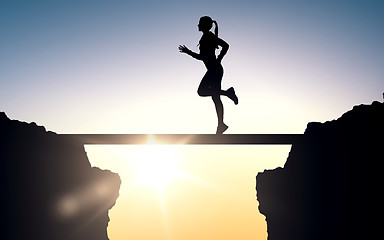 Image showing happy young sports woman running outdoors