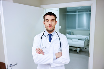 Image showing doctor with stethoscope at hospital corridor