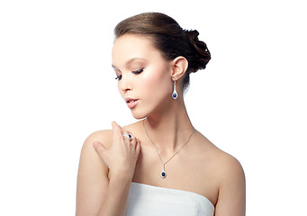 Image showing beautiful woman with earring, ring and pendant