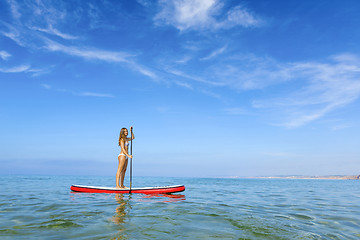 Image showing Woman practicing paddle