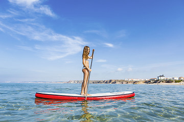 Image showing Woman practicing paddle