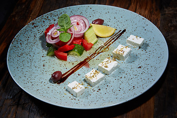 Image showing Fresh Greek salad in a bowl,