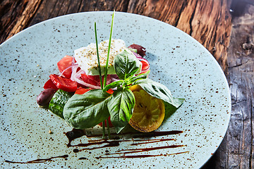 Image showing Fresh Greek salad in a bowl,