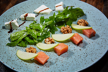 Image showing Homemade salad with apple and salmon