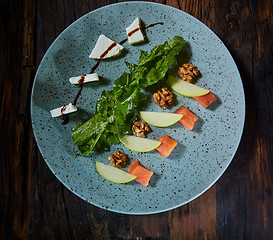 Image showing Homemade salad with apple and salmon