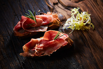 Image showing Two slice of Spanish tapas with jamon