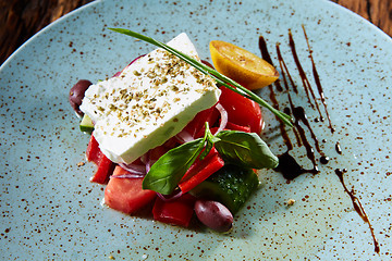 Image showing Fresh Greek salad in a bowl,