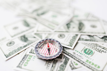 Image showing close up of compass and dollar money