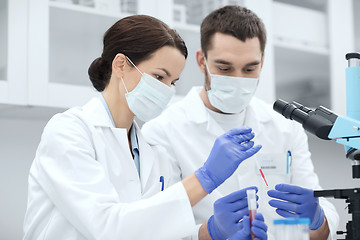 Image showing young scientists making test or research in lab