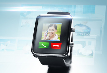 Image showing close up of black smart watch with video call icon