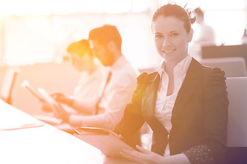 Image showing business woman at  office people group on meeting  in background