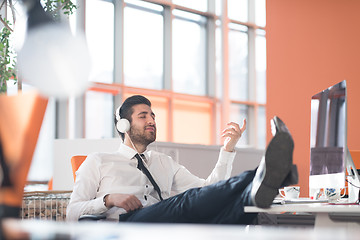 Image showing relaxed young business man at office