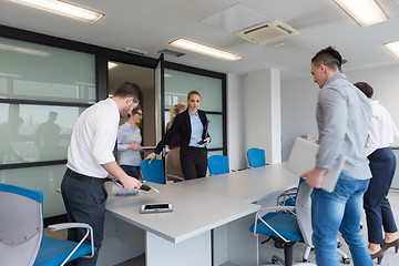 Image showing business people group entering meeting room, motion blur