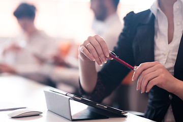 Image showing woman hands holding pen on business meeting