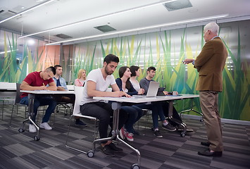 Image showing teacher with a group of students in classroom