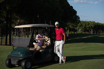 Image showing couple in buggy on golf course