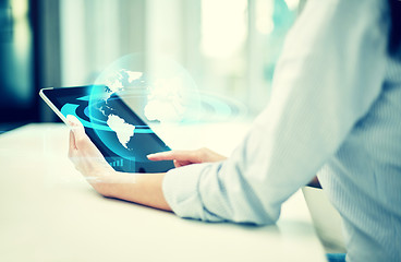 Image showing close up of woman hands with tablet pc at office