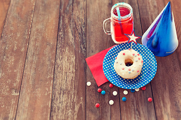 Image showing donut with juice and candies on independence day