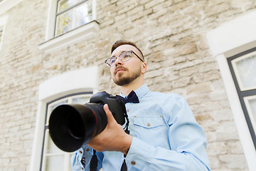 Image showing young hipster man with digital camera in city