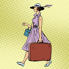 Image showing Woman traveler with suitcase