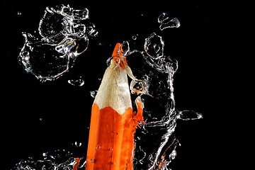 Image showing Crayon under water with bubbles of air.