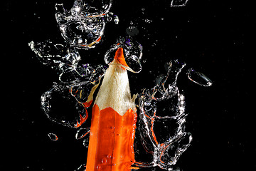 Image showing Crayon under water with bubbles of air.