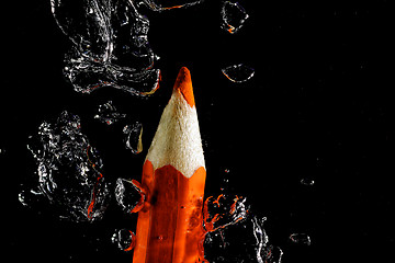 Image showing Crayon under water with bubbles of air.