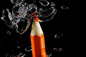 Image showing Crayon under water with bubbles of air.