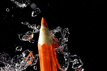 Image showing Crayon under water with bubbles of air.