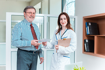 Image showing The patient and his doctor in medical office