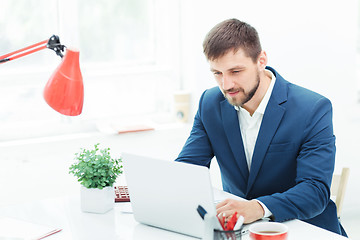 Image showing The elegant businessman sitting in  the office