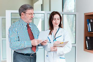 Image showing The patient and his doctor in medical office