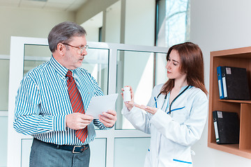 Image showing The patient and his doctor in medical office