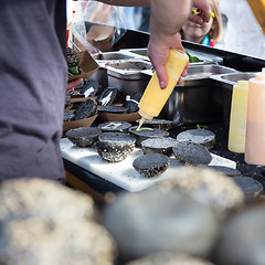 Image showing Burgers ready to serve on food stall.