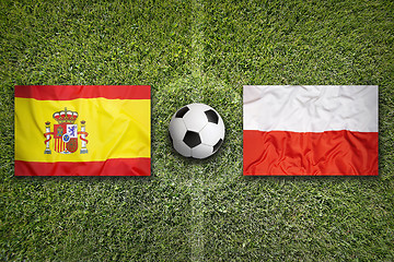 Image showing Spain vs. Poland flags on soccer field