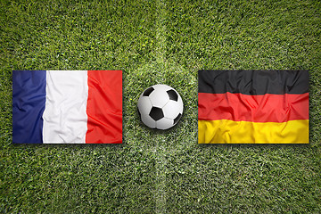 Image showing France vs. Germany flags on soccer field