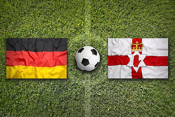 Image showing Germany vs. Northern Ireland flags on soccer field