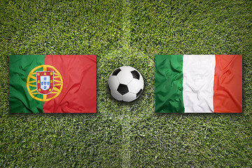 Image showing Portugal vs. Italy flags on soccer field