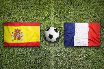 Image showing Spain vs. France flags on soccer field