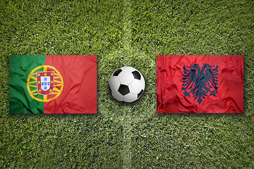 Image showing Portugal vs. Albania flags on soccer field